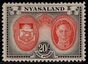 NYASALAND PROTECTORATE GVI SG157, 20s scarlet & black, LH MINT. Cat £32.