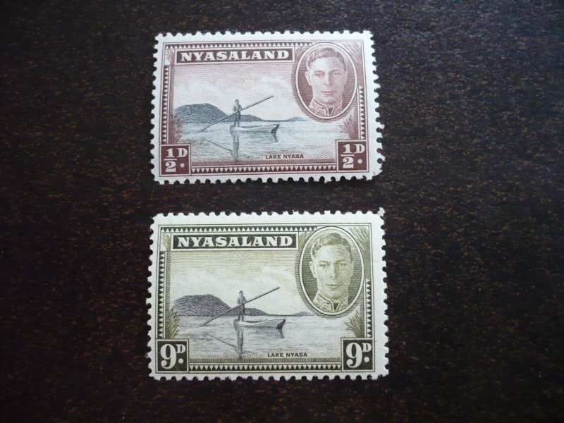 Stamps - Nyasaland - Scott# 68, 75 - Mint Hinged Part Set of 2 Stamps