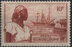 Guadeloupe 189 (mh) 10c Basse-Terre harbor & woman, red brn (1947)