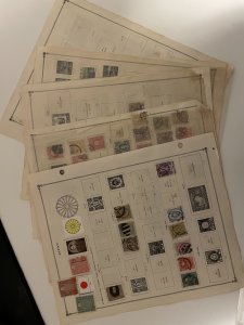 Collection of classic Japan stamps on old Scott pages