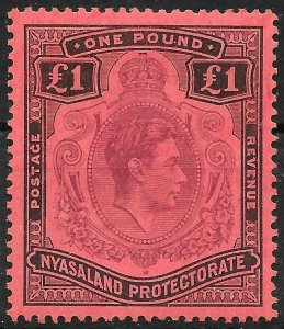 NYASALAND SG143c 1938 £1 PURPLE & BLACK ON RED SERIF ON G VAR MTD MINT