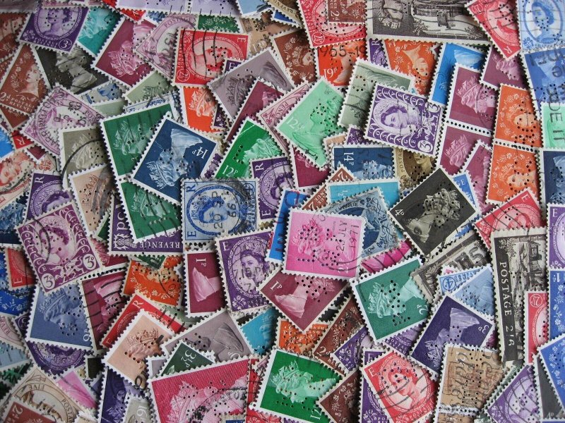 Great Britain QEII era perfins mixture (duplicates, mixed condition) of 200 