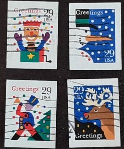 US Scott # 2799-2802; four used 29c Christmas imperfs, 1993; VF centering