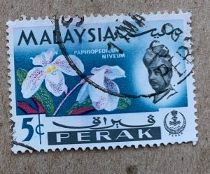 Perak 1965 5c Orchid, used. Scott 141, CV $0.25. SG 165