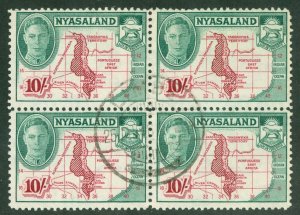 SG 156 Nyasaland 1945. 10/- claret & emerald. Very fine used block of 4