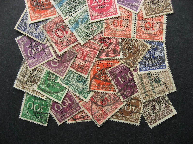 Germany perfins 40 inflationary era numerals type. Duplicates?, mixed condition.