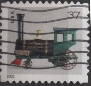 US 3643 (used on paper) 37¢ antique toy locomotive (from bklt) (2002)