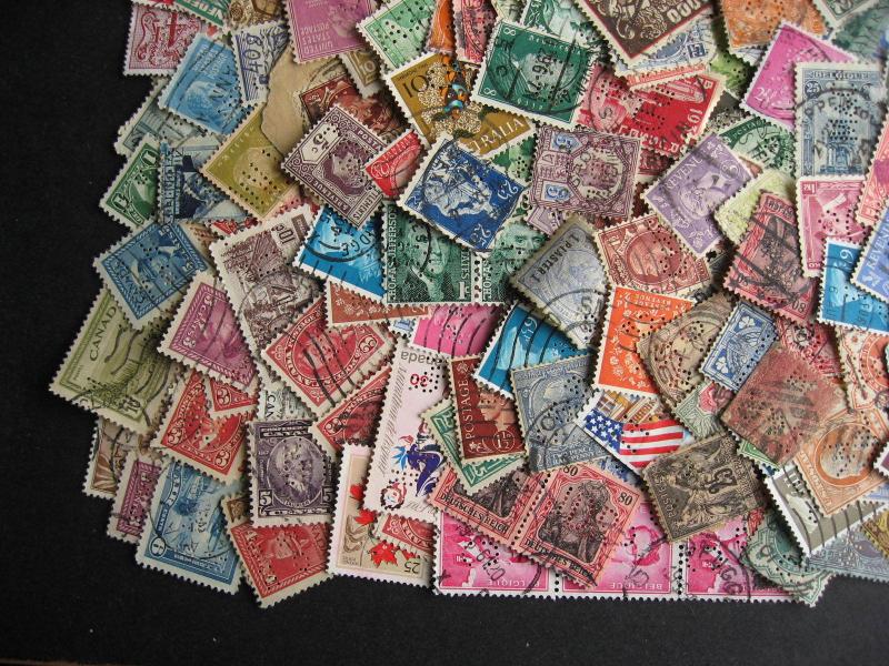 Worldwide perfins mixture of 300 many countries, duplicates,mixed condition