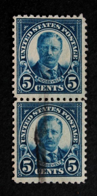 US #557 Used Vertical Pair with Heavy Inked Offset on Back