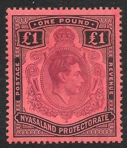 NYASALAND SG143 1938 £1 PURPLE & BLACK ON RED MTD MINT