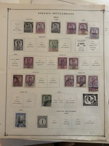 Collection of classic Malaya stamps on old Scott pages