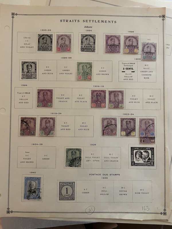Collection of classic Malaya stamps on old Scott pages