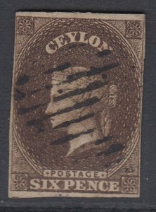 SG 6b Ceylon 1857-59. 6d deep brown used with a barred cancellation. 4 close