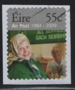 Ireland 2009 used Sc 1834d 55c Woman at counter An Post 25th ann Perf 14 on p...