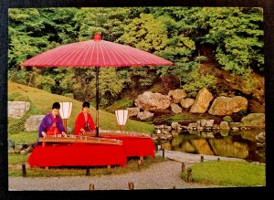 Japan. Postcard. Traditional Japanese musical performance in the garden of...