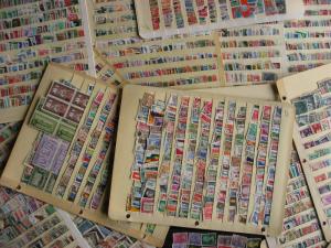 WW boxlot stamps haphazardly stuck into stock pages,no apparent order,what lurks