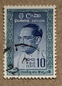 Ceylon 1961 10c Bandaranaike, dark temples, used. Scott 362a, CV $0.25. SG 471a