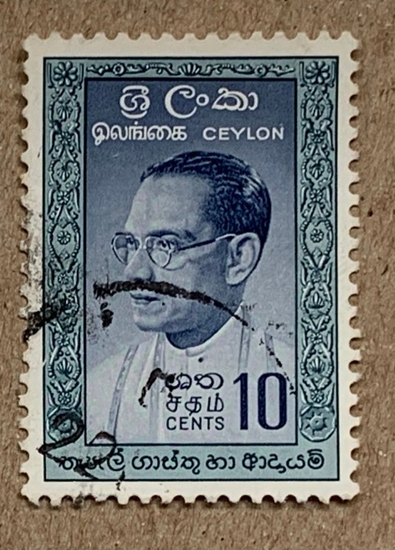 Ceylon 1961 10c Bandaranaike, dark temples, used. Scott 362a, CV $0.25. SG 471a