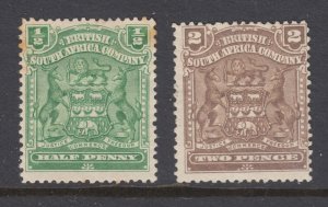 Rhodesia Sc 59, 61 MLH. 1898 Coat of Arms, both stamps have a small thin, OG