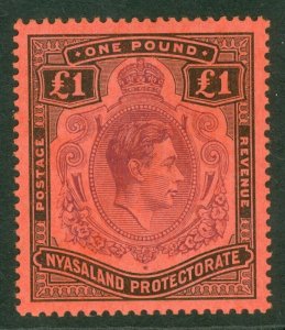 SG 143 Nyasaland 1938-44. £1 purple & black/red. Fine unmounted mint CAT £65