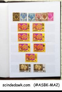 COLLECTION OF MALAYSIA STAMPS FROM 1953 IN SMALL STOCK BOOK - 140 STAMPS