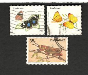 1988-92 Zimbabwe SC #558 #671 #673 Butterflies & Grasshopper used stamps