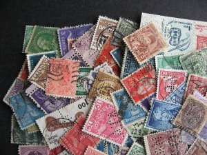 Worldwide perfins, 100 from various countries. Duplicates?, mixed condition. 