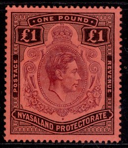 NYASALAND PROTECTORATE GVI SG143, £1 purple & black/red, LH MINT. Cat £65.