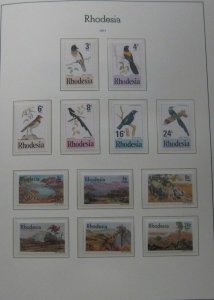 RHODESIA 1924-1977, in Tudor Hingeless album, used & mint, Scott $620.00