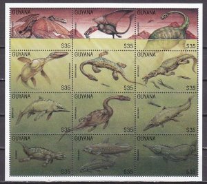 Guyana, Scott cat. 3043 a-l. Dinosaurs sheet of 12. ^