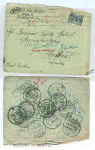 Austria 335 Useage to India with numerous forwardings and flood of backstamps.  Upper edge of cover guide battered.