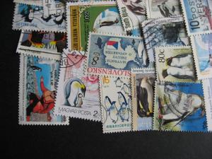 Topical hoard breakup 35 penguins. Mixed condition, few duplicates