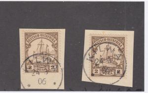 GERMAN EAST AFRICA # 11 x 2 ON PIECES WITH SUPERB KILWA DATED TOWN CANCELS