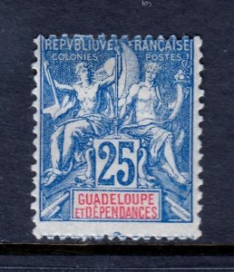 GUADELOUPE — SCOTT 38 — 1900 25c BLUE NAVIGATION & COMMERCE — MH — SCV $100