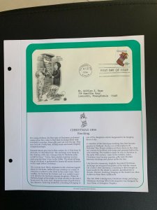 Christmas 1994 stocking stamp FDC with introduction pages