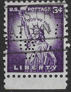 US #1035  used.   Perfin.  Lady Liberty.  In God We Trust.
