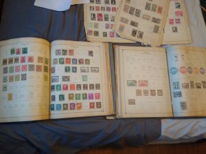 Two international junior postage stamp albums with 1000+ stamps inside