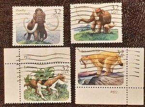 US Scott # 3077-3080; Four used 32c Prehistoric Animals, 1996; VF centering