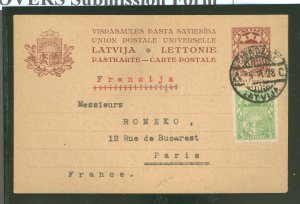 Latvia  1928 prepaid postcard with additional stamp sent to Paris, France with Riga Railroad Station cancellation