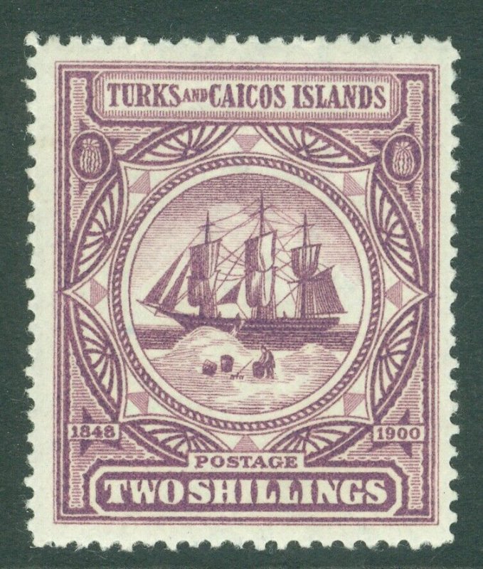 SG 108 Turks & Caicos 2/- purple. Lightly mounted mint CAT £60 