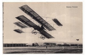 Farman biplane airplane postcard in the foreground