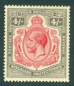 SG 95 Nyasaland protectorate 1913. 4/- carmine & black. Lightly mounted mint...