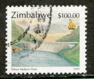 2000 Zimbabwe Sc #853 / $100 Hydro Dam used postage stamp. Cv $6.25