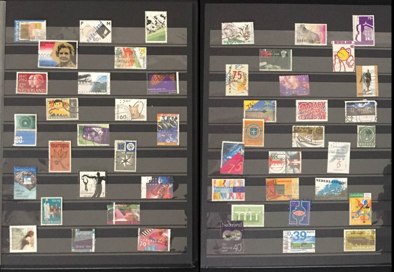 COLLECTION OF NETHERLANDS STAMPS IN AN ALBUM - 500 STAMPS