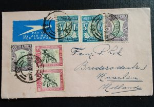 An envelope with several South African postage stamps, sent by airmail to Haa...