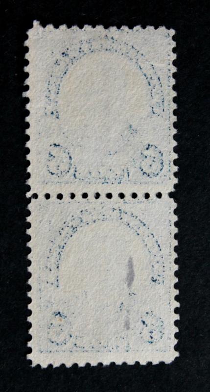 US #557 Used Vertical Pair with Heavy Inked Offset on Back