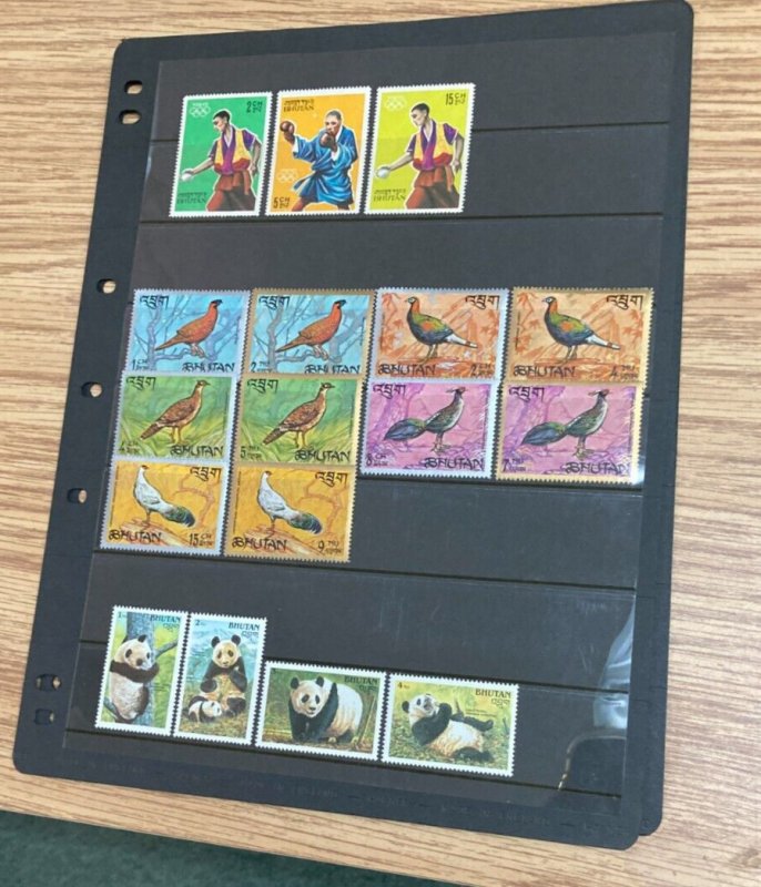 KAPPYSSTAMPS BHUTAN  34 DIFFERENT MINT NH INCL PANDA SET ON PAGES  A625