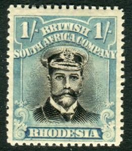 RHODESIA-1923 1/- Black & Dull Blue.  A mounted mint example Sg 317