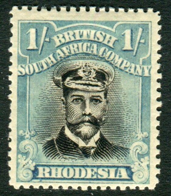 RHODESIA-1923 1/- Black & Dull Blue.  A mounted mint example Sg 317