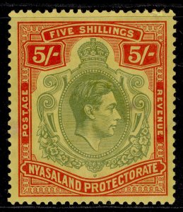NYASALAND PROTECTORATE GVI SG141, 5s pale green & red yellow, M MINT. Cat £55.